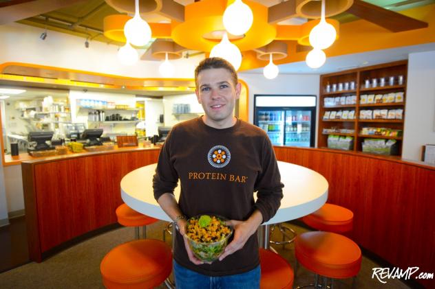 Protein Bar creator and owner Matt Matros stands at the center of the healthy eatery's first D.C. location in Penn Quarter.